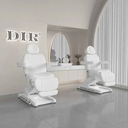 Modern spa with two electric beauty beds, white chairs, and large mirror in minimalist setting